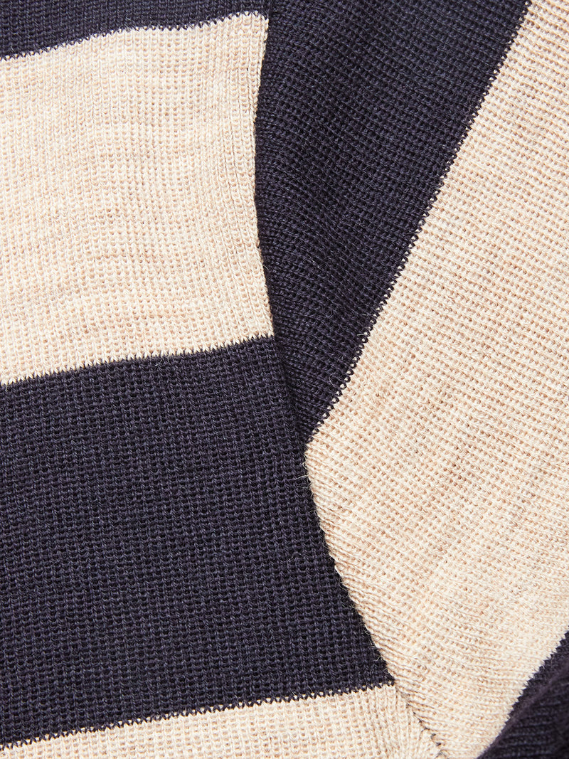 Close-up of the Blue de Gênes Toyama Stripe Knit L/S in Dark Navy, showcasing wide cream and navy stripes and a soft, textured yarn—ideal for cozy layering.