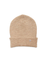 The Boshi Beanie - Oat by Blue de Gênes is a beige Merino wool rib beanie with a folded cuff and a small embroidered patch featuring a white and purple cross. Knitted in Denmark, its shown laid flat on a white background.