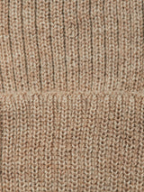 Close-up of the Blue de Gênes Boshi Beanie - Oat, highlighting its beige ribbed knit texture and a horizontal seam across the middle, reminiscent of classic Merino Wool beanies.