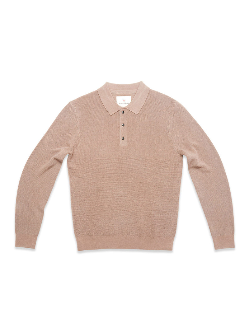 The Porto Polo Knit - Fungi by Blue de Gênes is a light brown, long-sleeve wool polo with a collar and four dark buttons, shown laid flat on a white background.
