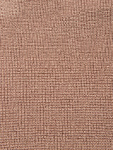 Close-up of the Porto Polo Knit - Fungi by Blue de Gênes: textured warm brown fabric with a grid-like woven pattern and raised squares, capturing the polo's casual elegance.