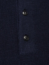 Close-up of the Blue de Gênes Porto Polo Knit in Navy, showcasing its waffle-knit texture and two vertically sewn black buttons on the placket for a touch of casual elegance.