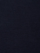 Close-up of Blue de Gênes’ Porto Polo Knit - Navy, featuring a soft, textured fabric with a grid-like woven pattern and subtle checkerboard effect for casual elegance.