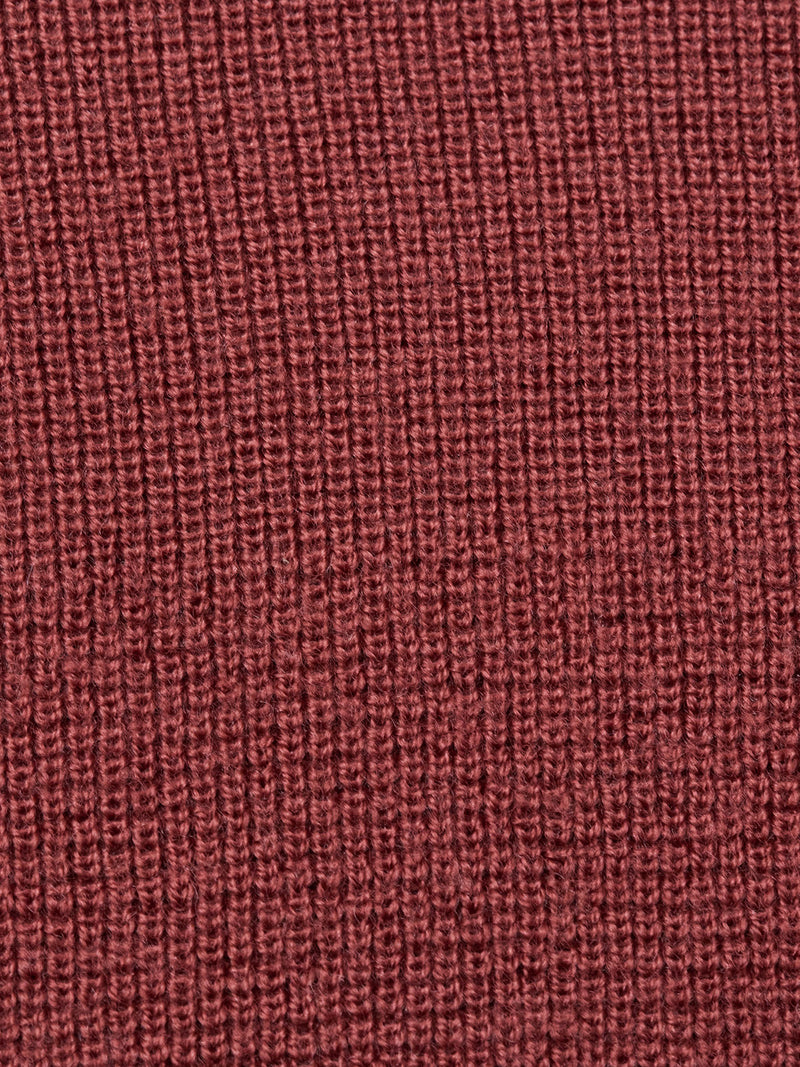 Close-up of the Porto Polo Knit in Henna by Blue de Gênes, highlighting its reddish-brown ribbed texture—ideal for men’s luxury knitwear like this refined wool polo shirt.
