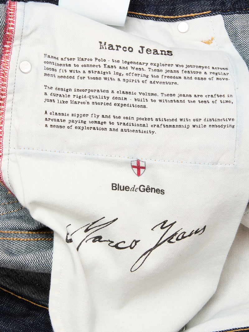 Close-up of the inner label on Blue de Gênes Marco Rinse Jeans - Rinse Wash, featuring a relaxed fit design. The label displays the brand logo and signature, inspired by classic 100% cotton denim craftsmanship.