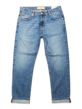 A pair of Blue de Gênes Marco Used Jeans - Used in blue, featuring a relaxed fit, classic five-pocket design, rolled cuffs, and 100% cotton denim, laid flat on a white background.