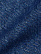 Close-up of the Yuma Fano Jacket - Denim Blue by Blue de Gênes, highlighting its heavy cotton blend denim fabric with detailed texture, weave pattern, subtle shading, and signature diagonal lines.