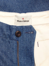 Close-up of the waistband and zipper area of the Shogun Fano Pant - Denim Blue by Blue de Gênes, featuring a black button, gold zipper, and a Blue de Gênes label on white lining, crafted from heavy cotton blend denim.