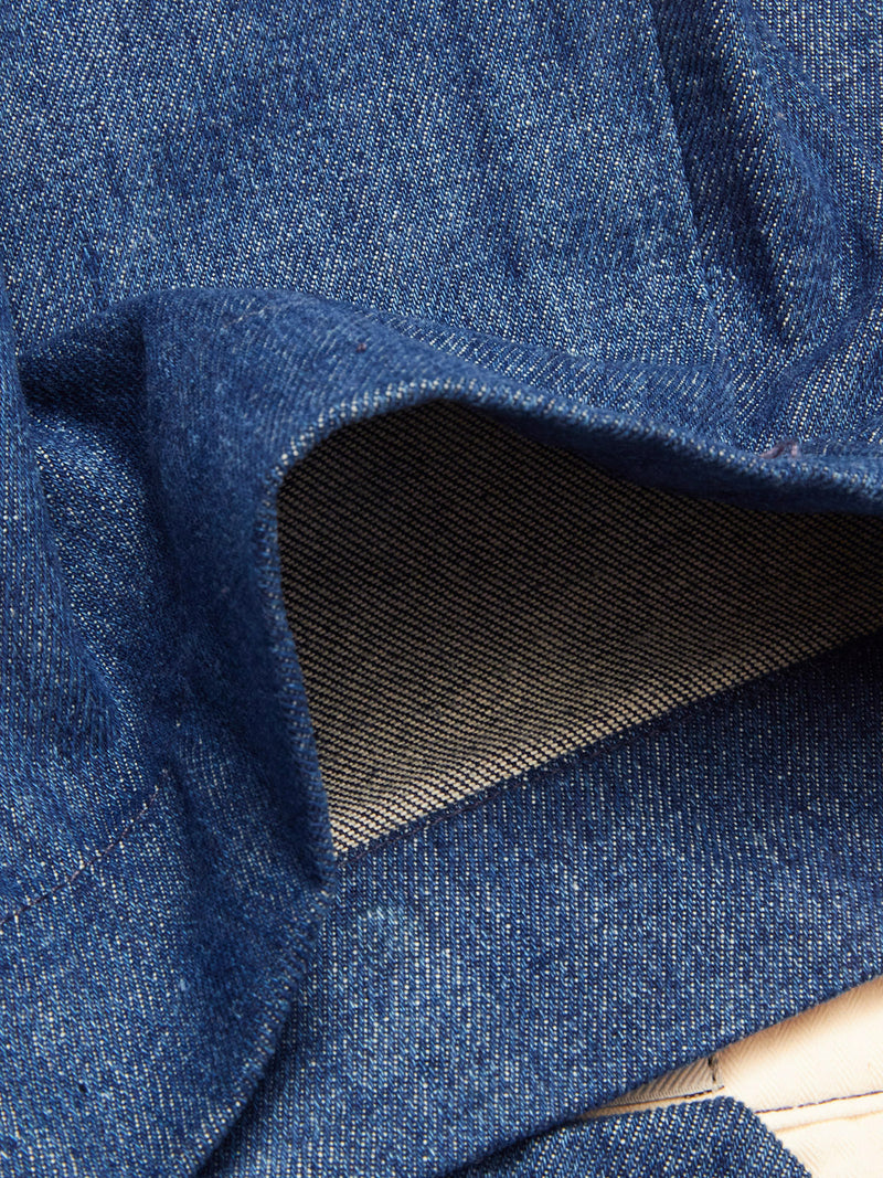 Close-up of Blue de Gênes Shogun Fano Pant in Denim Blue, with the cuff turned up to reveal lighter inner fabric, detailed stitching, and the durable cotton blend construction.