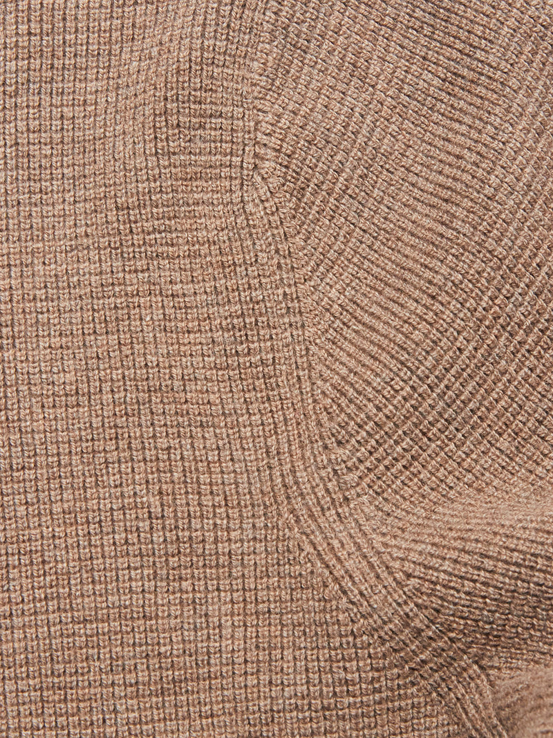 Close-up of the Gifu Knit Cardigan - Chocolate by Blue de Gênes, showing textured brown fabric with a ribbed, grid-like pattern and visible seams.