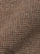 Close-up of the Gifu Knit Cardigan - Chocolate by Blue de Gênes, showcasing its textured brown wool blend with ribbed patterns, soft fibers, and a wavy surface.