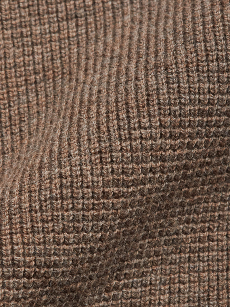Close-up of the Gifu Knit Cardigan - Chocolate by Blue de Gênes, showcasing its textured brown wool blend with ribbed patterns, soft fibers, and a wavy surface.