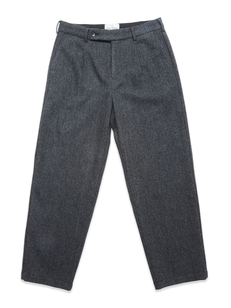 The Kyoto Pant - Black Pattern by Blue de Gênes is a relaxed straight-leg style featuring button and zipper closure, belt loops, and side pockets, shown laid flat on a white background.