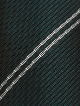 Close-up of Blue de Gênes Nekutaki Tie #D - Green Stripe: a textured dark green tie with a grid pattern and two diagonal reflective white stripes, making it an ideal mens fashion accessory.