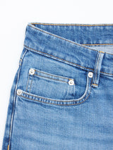 Close-up of the upper front section of BGvinci Hera Used Jeans - Used by Blue de Gênes, highlighting the waistband, front pocket, coin pocket with metal rivets, and orange stitching on blue-black denim.