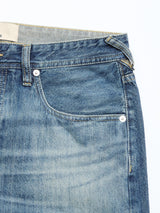 Close-up of the front top section of Blue de Gênes BGgiacomo Tim Jeans in antique wash, highlighting the waistband, button, front pocket, and belt loop. These relaxed fit jeans showcase careful craftsmanship and timeless style.