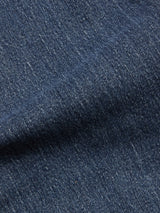 Close-up of BGvinci Striker Jeans - Dark Distress by Blue de Gênes, highlighting the blue comfort stretch denim's textured weave, diagonal seam, and worn look with visible fibers and stitching typical of regular fit jeans.