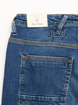 Close-up of BGrepi Kanto Jeans - Used by Blue de Gênes in blue, featuring a back pocket, belt loops, and a beige brand tag at the waistband. Contrast stitching highlights the comfort stretch denim fabric.