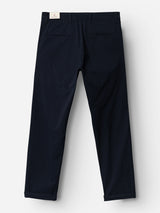 The BGmenzo Vecchio Chino - Dark Navy by Blue de Gênes is shown from the back, with two welt back pockets and a white label on the waistband. These vintage chinos are laid flat on a white background.