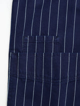 Close-up of the BGkendrick Toll Jacket by Blue de Gênes, featuring navy cotton with vertical white stripes and a neatly stitched rectangular pocket for a classic worker jacket style.