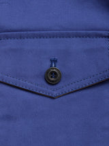 Close-up of the BGcanopy Jacket - Navy Peony by Blue de Gênes, showing a blue pocket with a pointed flap and black button. Visible stitching highlights its workwear heritage and attention to detail.