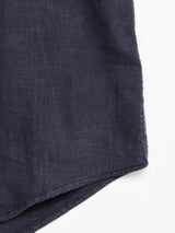A close-up of the Blue de Gênes BGenric Hope S/S Shirt in dark navy, highlighting its linen weave texture and fabric edge against a white background.