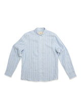 The BGenrico Mida Shirt - Blue Stripe by Blue de Gênes features light blue linen with subtle vertical stripes, long sleeves, a cut away collar, and white buttons. Ideal for summer, it's shown against a white background.