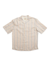 The Blue de Gênes BGcody Fling Shirt in Pale Khaki is a beige linen short sleeve shirt with a relaxed resort fit and vertical white and dark gray stripes, shown laid flat on a white background.