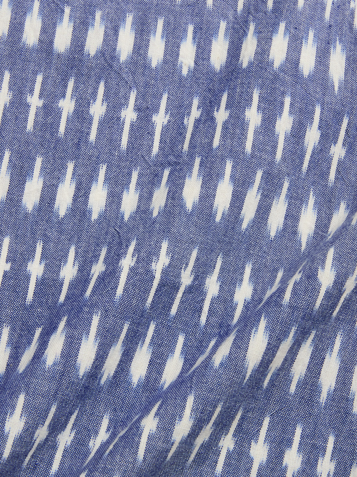 The BGforma Onda S/S Shirt by Blue de Gênes features a blue tribal-inspired pattern of white blurred geometric crosses on soft 100% cotton—ideal as an oversized resort shirt.