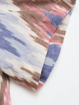 Close-up of the BGponti Kala S/S Shirt by Blue de Gênes, featuring a tribal-inspired multi pattern in blue, brown, pink, and white on 100% cotton. Detailed stitching and hem are visible against a white background.