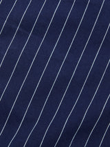 Close-up of BGcupra Toll Shorts - Navy Stripe by Blue de Gênes: dark blue fabric with evenly spaced white diagonal pinstripes, revealing a breathable texture ideal for summer workwear.