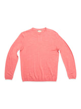The BGmonty Knit - Coral by Blue de Gênes is a regular-fit, long-sleeve crewneck jumper in solid pink, made from a soft cotton-linen blend and shown laid flat on a white background.