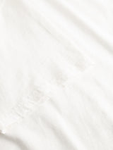 A close-up view of the BGoscar T-Shirt - Snow Fall by Blue de Gênes, crafted from smooth, soft 100% white cotton with gentle folds—ideal for a comfortable crewneck fit.