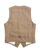 The BGcanna Lin Gilet in Grey Mel by Blue de Gênes is shown from the back, featuring a fabric belt with a small adjustment buckle and two pointed hems—a refined update to the classic casual waistcoat.