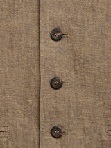 Close-up of the BGcanna Lin Gilet in Grey Mel by Blue de Gênes, showing its textured fabric with four dark buttons in a vertical line and a visible weave pattern.