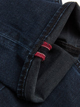 A close-up of the cuff on BGvinci Black OD Jeans by Blue de Gênes in blue black denim, showing a visible red and white selvedge edge and contrasting stitching.