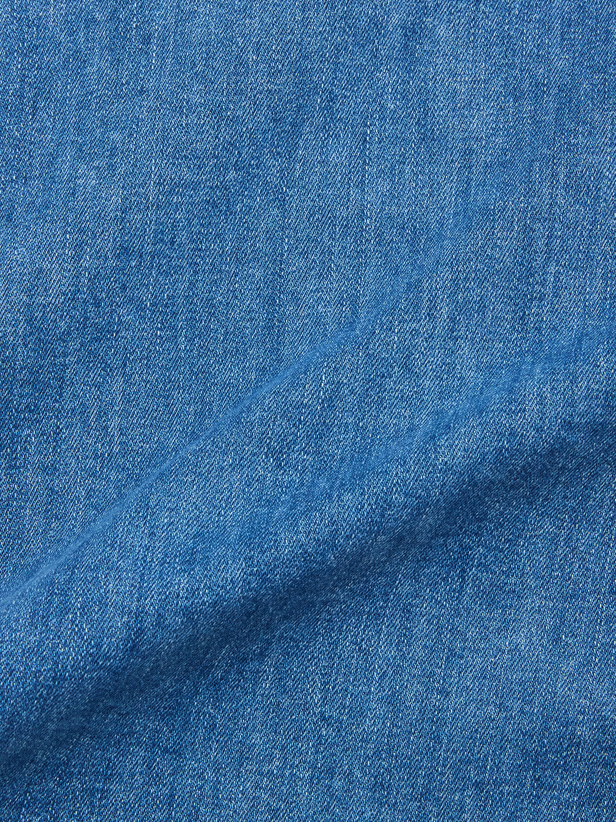Close-up of BGpontus Denim Overshirt - Used by Blue de Gênes, featuring blue cotton blend denim with a textured weave and diagonal fold—perfect for a relaxed fit overshirt.