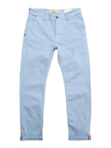 The BGpaulo Pavia Pant in Blue Fog by Blue de Gênes features cotton stretch fabric, front and back pockets, belt loops, and a button-zipper closure. Presented laid flat with gently rolled cuffs at the ankles.