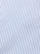 Close-up of Blue de Gênes BGsander Oxford Shirt—100% cotton white fabric with thin, evenly spaced blue stripes, forming a classic pattern.