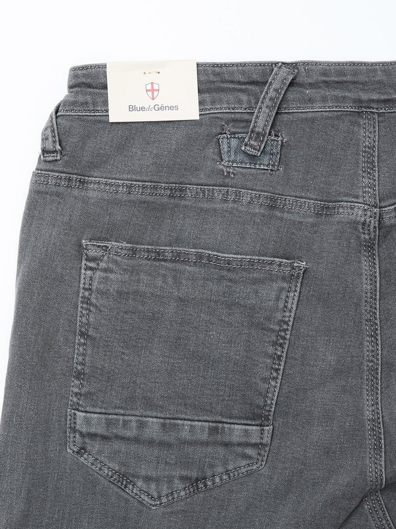 Close-up of the back of Blue de Gênes Repi Giulio Light V2 Jeans in grey denim, showing a single back pocket, belt loops, and brand tag on the waistband. Crafted from comfort stretch denim for all-day ease.