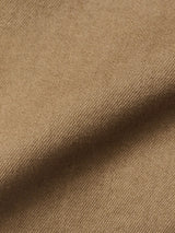 Close-up of the Paulo Pavia 1 V2 Chino - Fudge by Blue de Gênes, featuring light brown, textured cotton stretch fabric with a soft, slightly fuzzy look and subtle folds typical of vintage military pants.