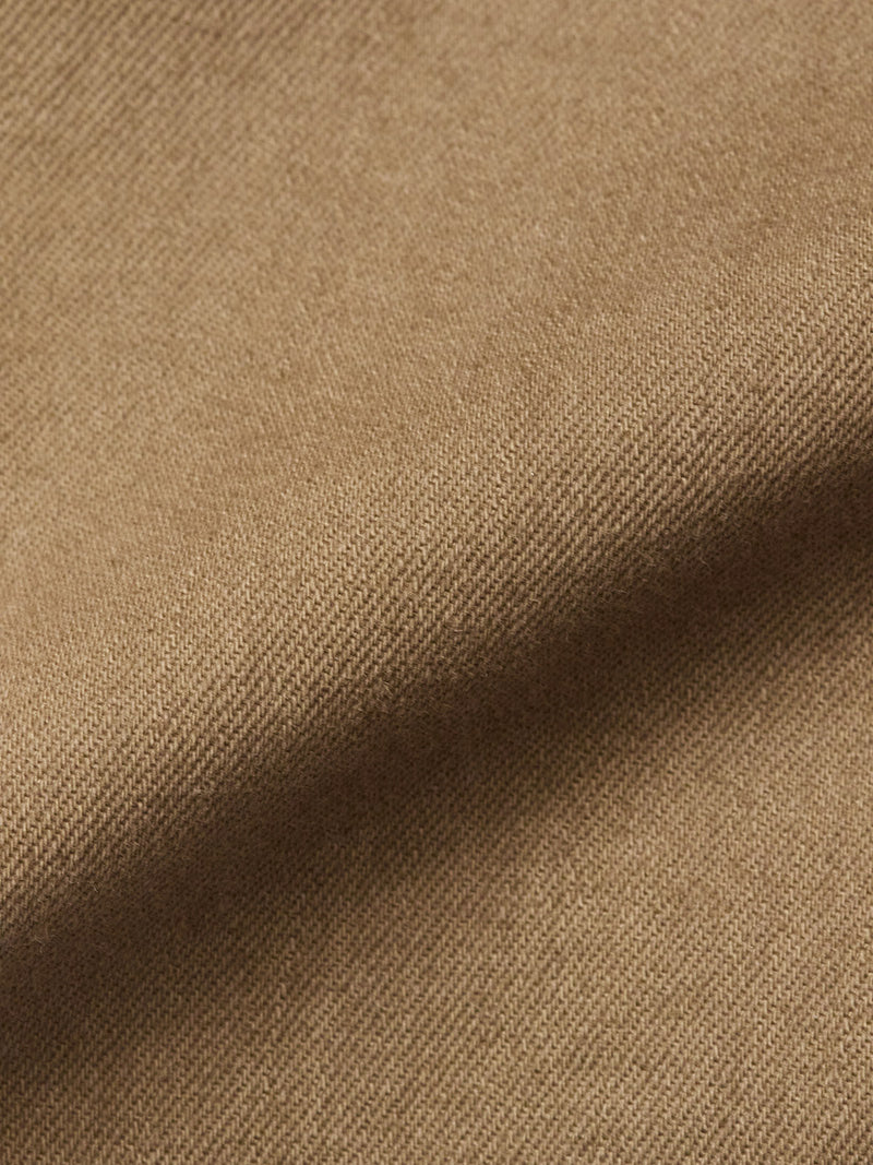 Close-up of the Paulo Pavia 1 V2 Chino - Fudge by Blue de Gênes, featuring light brown, textured cotton stretch fabric with a soft, slightly fuzzy look and subtle folds typical of vintage military pants.