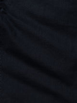 Close-up of Blue de Gênes BGpaulo Pavia 1 V2 Chino in Midnight Blue, showing textured fabric with gentle folds and subtle shadows and highlights reminiscent of military-inspired chinos.