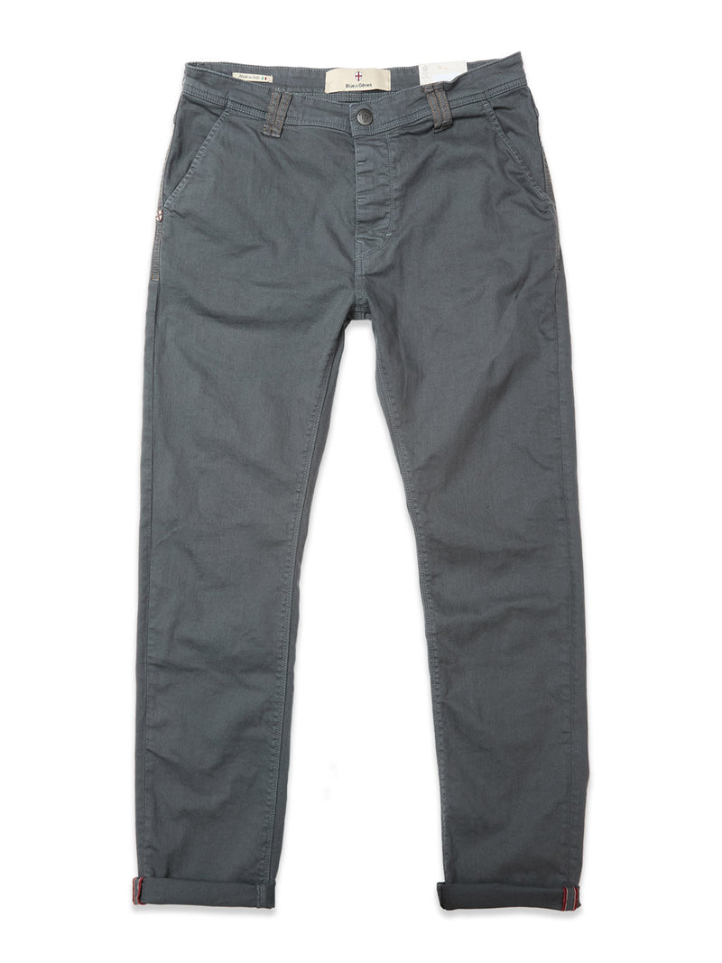 The Blue de Gênes Paulo Pavia 1 V2 Chino in Charcoal features side pockets, a button and zip fly, and rolled-up cuffs. Made from cotton stretch fabric, the pants are shown laid flat on a white background.