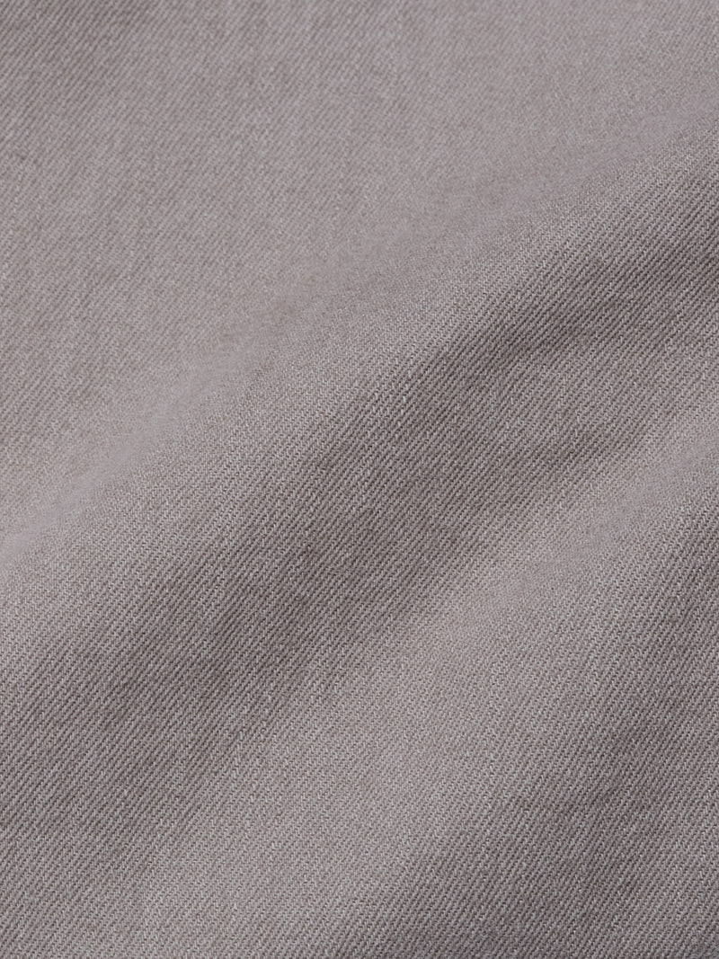 Close-up of Paulo Pavia 1 V2 Chino - Fungi by Blue de Gênes, showcasing light purple cotton stretch fabric with a smooth, subtly textured surface and distinct diagonal weave.