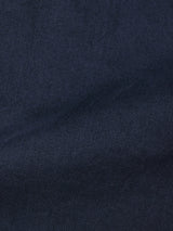 Close-up of Blue de Gênes Paulo Pavia 1 V2 Chino in Midnight Blue, showing dark blue cotton stretch fabric with a subtle diagonal weave and soft shadows—evoking the classic look of vintage military pants.