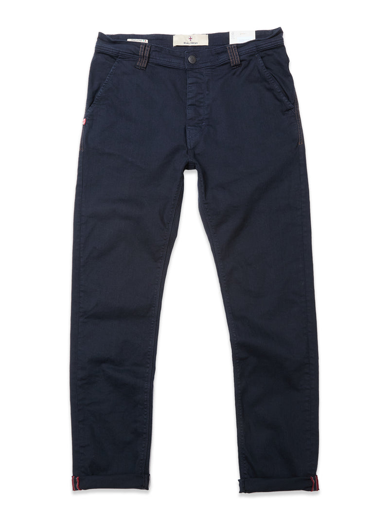 The Blue de Gênes Paulo Pavia 1 V2 Chino in Midnight Blue features a straight-leg cut, cotton stretch fabric, front pockets, button and zip closure, belt loops, and turned-up cuffs—vintage military-inspired, shown flat on a white background.