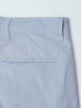 Close-up of the back pocket on Blue de Gênes BGmenzo Vecchio Chino in Blue Fog, highlighting the welt pocket, belt loops, and a subtle embroidered logo above the pocket.