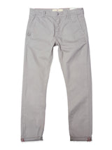A pair of BGpaulo Teo Pants in flint gray by Blue de Gênes, featuring a slim fit, button and zipper closure, side pockets, and rolled-up cuffs, laid flat on a white background.