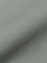 Close-up of shadow green textured fabric with a fine checkered pattern and gentle folds, showcasing the soft surface—ideal for crafting BGpaulo Teo Pant by Blue de Gênes, inspired by vintage military chinos.